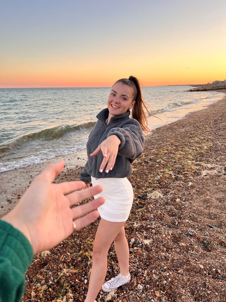 Image of Tahlya on a beach smiling, supporting her story that someone with epilepsy can improve their self-esteem