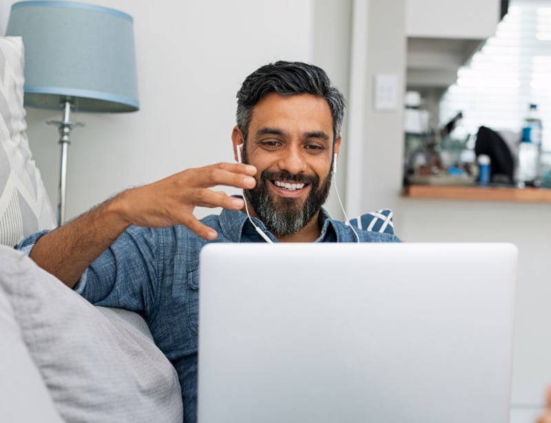 A bearded man taking part in a video call