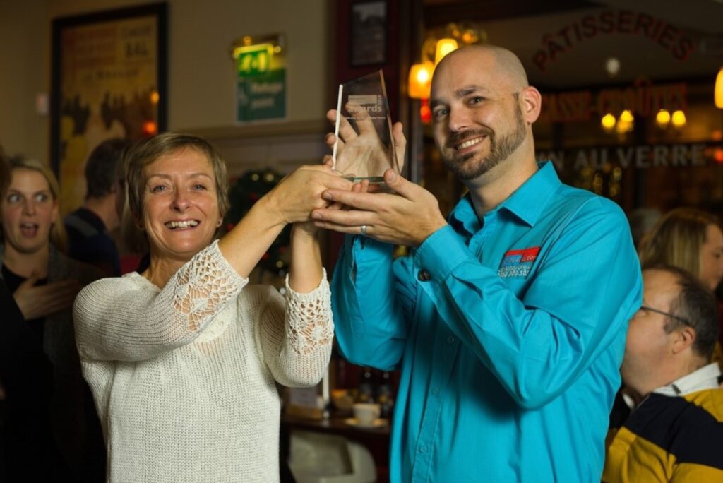 Simon and Jane celebrating an award at the Exeter group