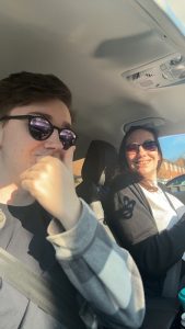 Jack and Rachel sat in the car wearing sun glasses and Rachel driving