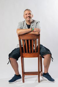 Murray sat on a chair